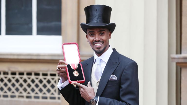Sir Mo Farah poses with his Knighthood following the Investiture ceremony at Buckingham Palace