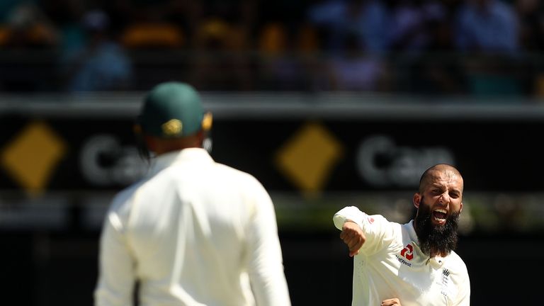 Moeen Ali of England celebrates after taking the wicket of Usman Khawaja of Australia during day two of the First Test