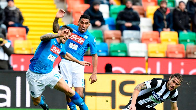 Napoli's Italian defender Christian Maggio (L) and Napoli's Brazilian midfielder Allan fight for the ball with Udinese's Italian defender Gabriele Angela d