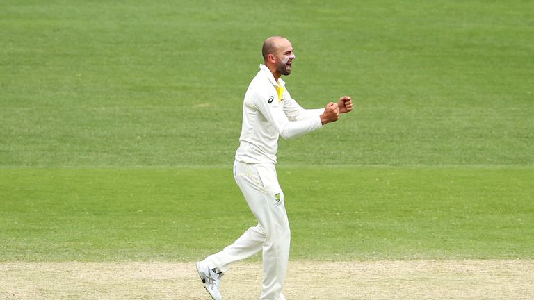 Nathan Lyon of Australia celebrates taking the wicket of Dawid Malan of England during day four of the First Test