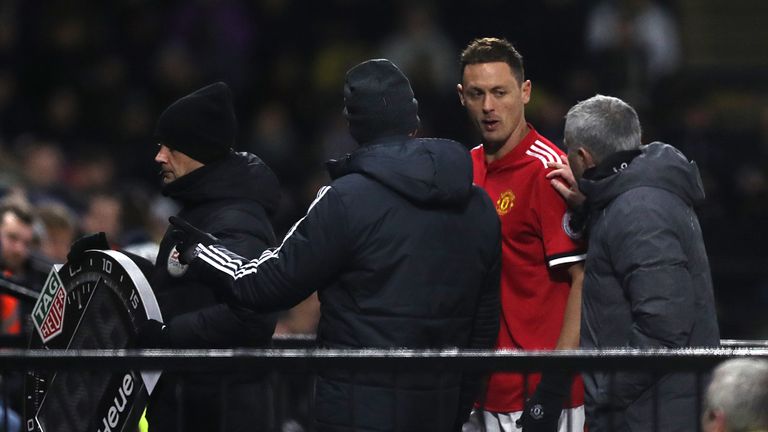Manchester United manager Jose Mourinho (right) with Manchester United's Nemanja Matic after being substituted during the Premier League match at Vicarage 
