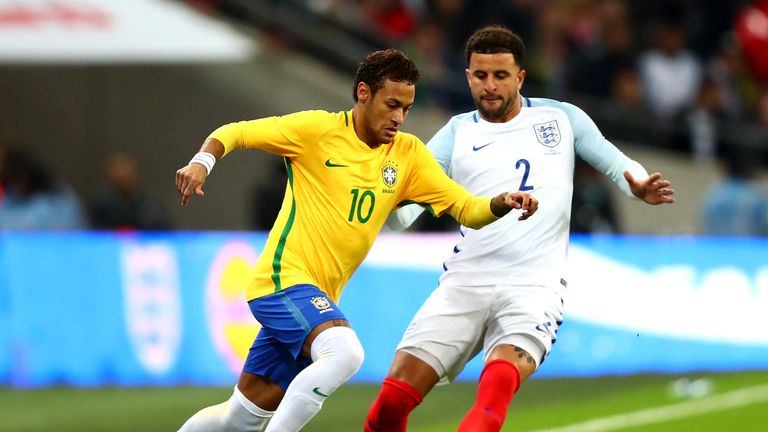 LONDON, ENGLAND - NOVEMBER 14: Neymar Jr of Brazil and Kyle Walker of England battle for possession during the international friendly match between England