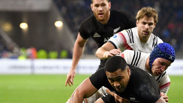 Centre Ngani Laumape (C) vies with France's flanker Wenceslas Lauret in France v New Zealand at Groupama Stadium in Decines-Charpieu, near Lyon