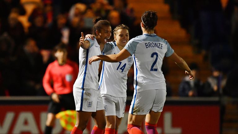 Nikita Parris (L) celebrates scoring England's third 