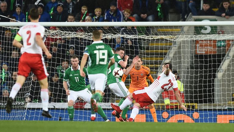 Xherdan Shaqiri of Switzerland is awarded a penalty after alleged handball by Corry Evans of Northern Ireland