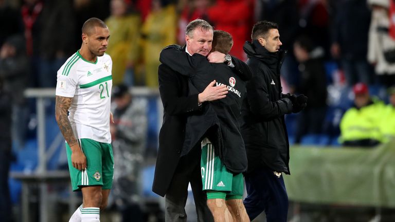 Northern Ireland manager Michael O'Neill embraces Jamie Ward after the FIFA World Cup Qualifying second leg match at St Jakob Park, Basel.