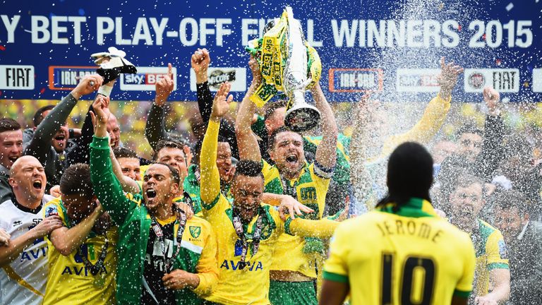 LONDON, ENGLAND - MAY 25:  Cameron Jerome of Norwich City (10) sprays his team mates with champagne in celebration after the Sky Bet Championship Playoff F