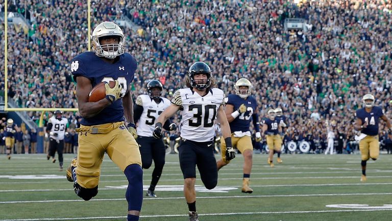 SOUTH BEND, IN - NOVEMBER 14:  Josh Adams #33 of the Notre Dame Fighting Irish rushes for a 98-yard touchdown against the Wake Forest Demon Deacons during 