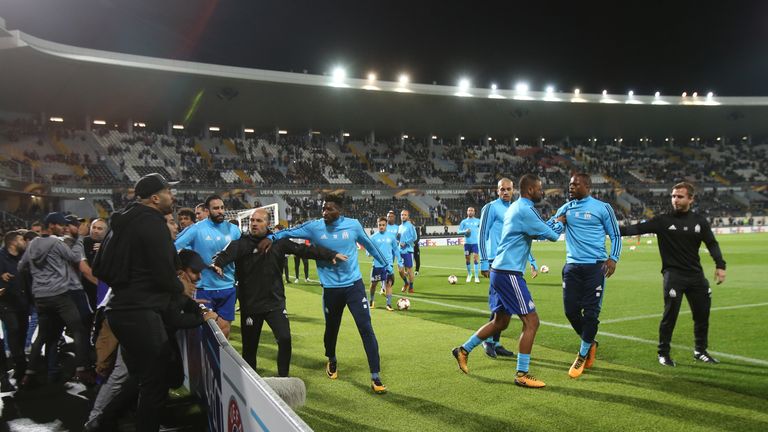 GUIMARAES, PORTUGAL - NOVEMBER 2: Confrontations between Olympique Marseille supporters and players before the start of the UEFA Europa League match betwee