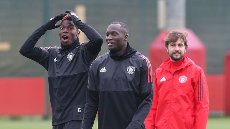 Paul Pogba and Romelu Lukaku share a joke during first team training