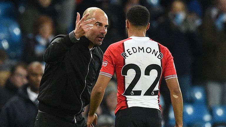 Pep Guardiola remonstrates with Nathan Redmond after the full-time whislte