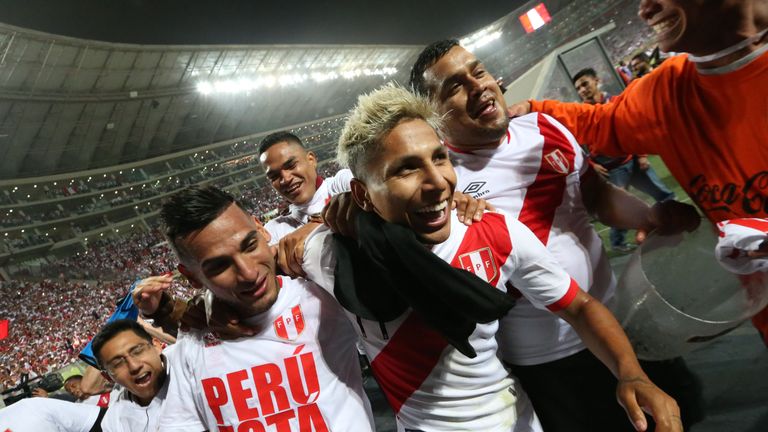 Peru's Raul Ruidiaz (C) and  his teammate Miguel Trauco (L) celebrate after defeating New Zealand by 2-0 and qualifying for the 2018 football World Cup, in