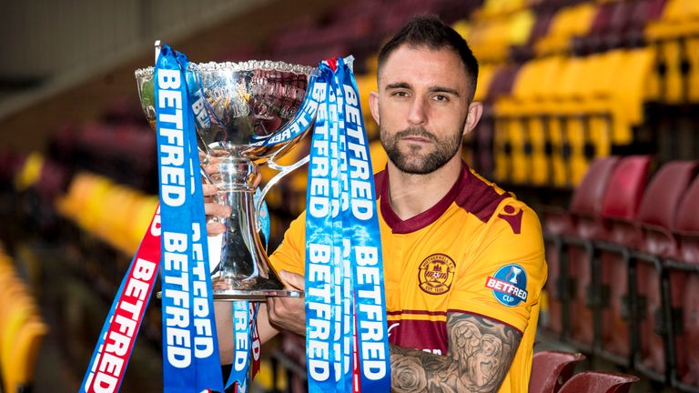 Motherwell's Peter Hartley holds the League Cup trophy