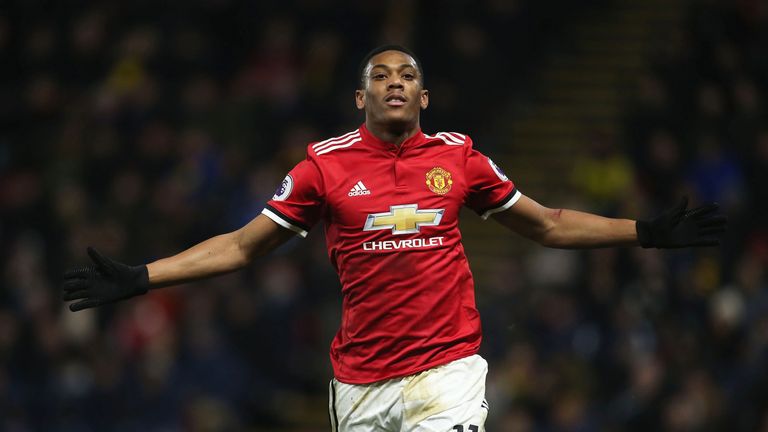 Anthony Martial celebrates after making it 3-0