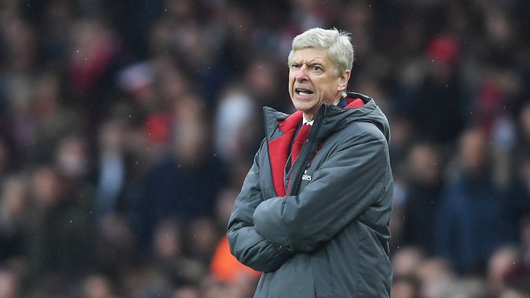 Arsene Wenger looks on from his technical area