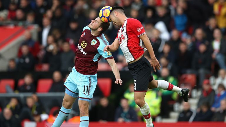 Chris Wood and Maya Yoshida battle for possession in the air