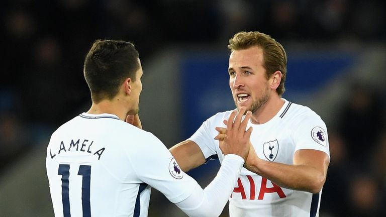 Harry Kane celebrates with Erik Lamela after pulling a goal back for Tottenham