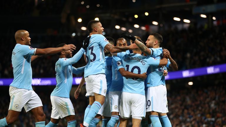 Manchester City players celebrate after taking a 1-0 lead