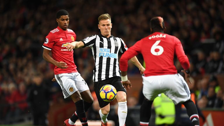 Matt Ritchie takes on Marcus Rashford and Paul Pogba