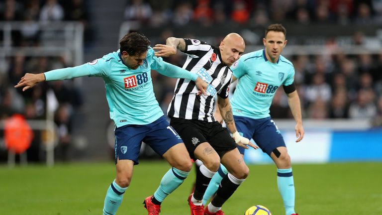 Charlie Daniels and Jonjo Shelvey in action at St James' Park