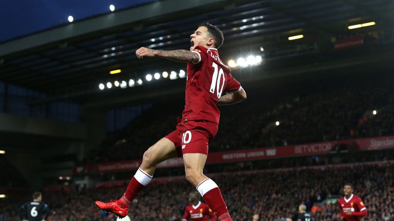 Philippe Coutinho celebrates after scoring Liverpool's third
