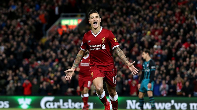 Philippe Coutinho celebrates after scoring Liverpool's third