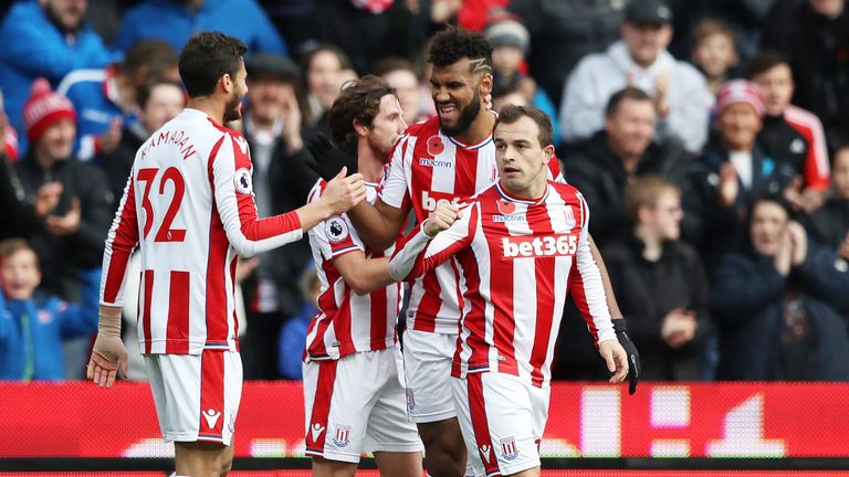 Xherdan Shaqiri is congratulated bt team-mates after his equaliser