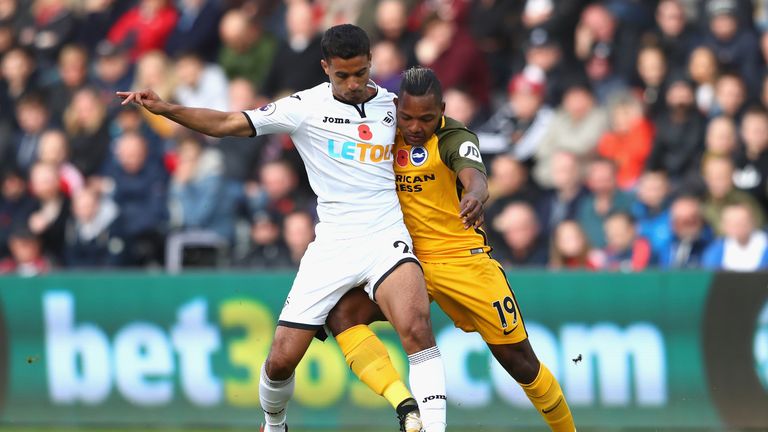 Kyle Naughton and Jose Izquierdo battle for the ball at the Liberty Stadium