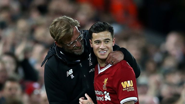 LIVERPOOL, ENGLAND - NOVEMBER 18:  Philippe Coutinho of Liverpool is congratulated by manager Jurgen Klopp after scoring his side's third goal during the P