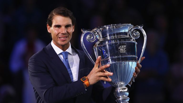 Rafael Nadal of Spain holds aloft the Emirates ATP year-end world No 1 trophy