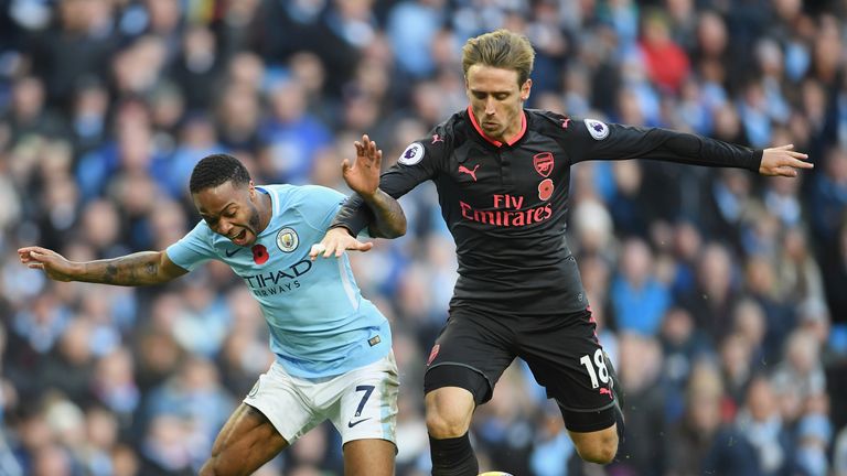 MANCHESTER, ENGLAND - NOVEMBER 05:  Nacho Monreal of Arsenal fouls Raheem Sterling of Manchester City and a penalty is awarded during the Premier League ma