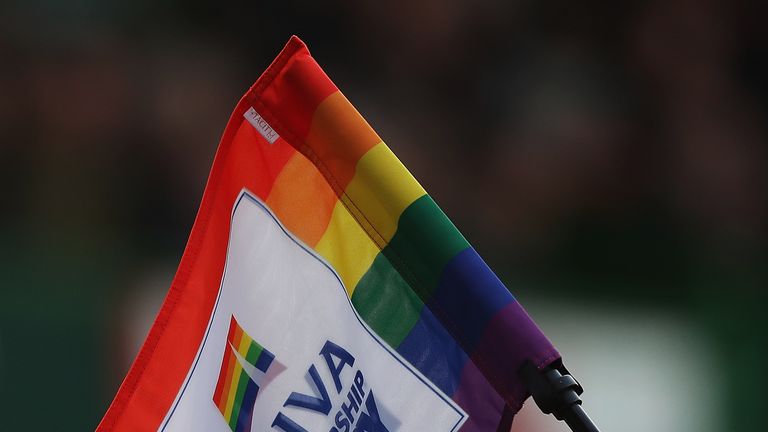 LEICESTER, ENGLAND - NOVEMBER 25:  A linesman holds his touch flag up which shows his support to charity Stonewalls Rainbow Laces campaign, which is endors