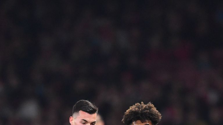 Red Star Belgrade's Serbian striker Nemanja Radonjic (L) vies with Arsenal's English midfielder Reiss Nelson during the UEFA Europa League Group H football