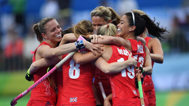Britain's Kate Richardson-Walsh (L) celebrates scoring a goal with teammates during the women's field hockey Britain vs Argentina match of the Rio 2016 Oly