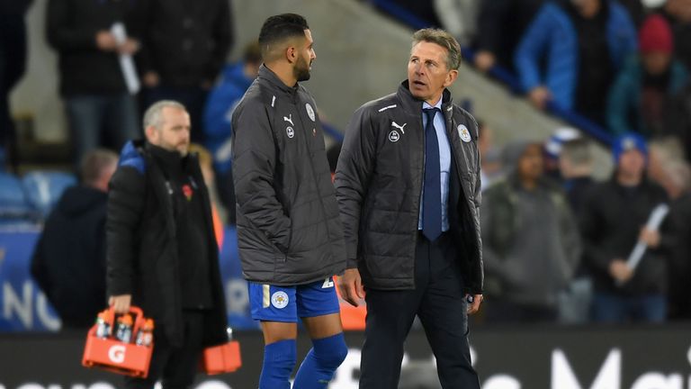 Riyad Mahrez in discussion with Leicester manager Claude Puel