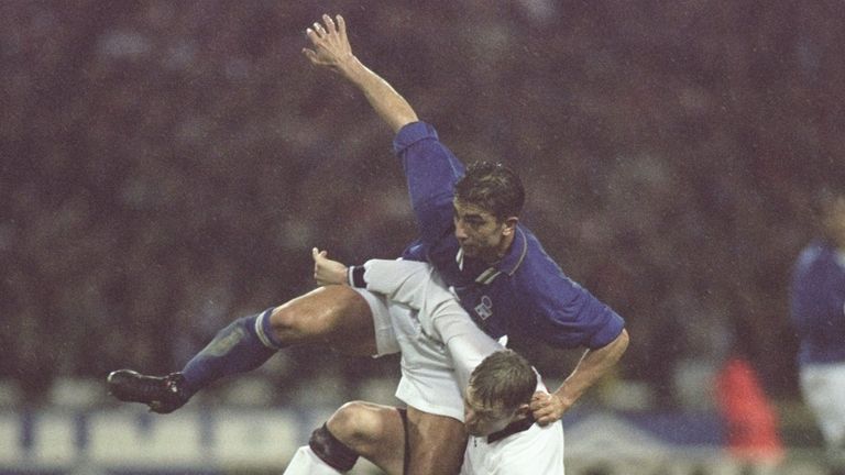 12 Feb 1997:  Roberto Di Matteo of Italy (left) tangles with David Batty of England. During the World Cup qualifier between England and Italy at Wembley St