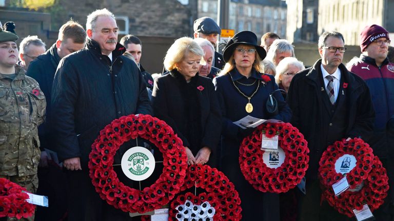 Hearts owner Ann Budge (centre) and Hibernian chairman Rod Petrie (left) at the Remembrance Service