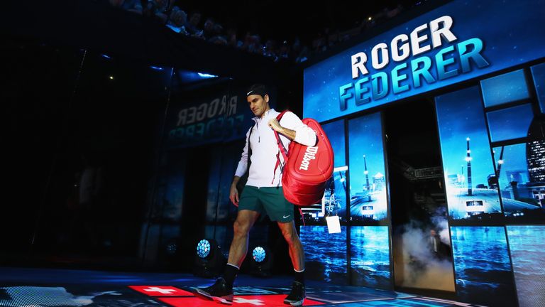 Roger Federer of Switzerland walks out for his opening singles round robin match against Jack Sock of the United States