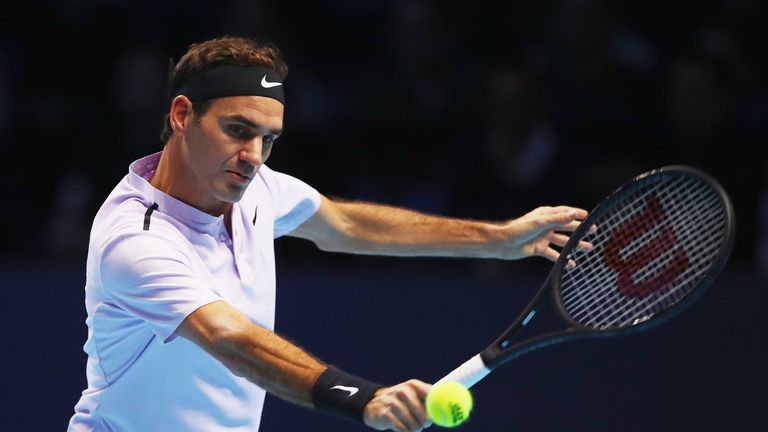 Roger Federer of Switzerland plays a backhand against Jack Sock of the United States during the Nitto ATP World Tour Finals