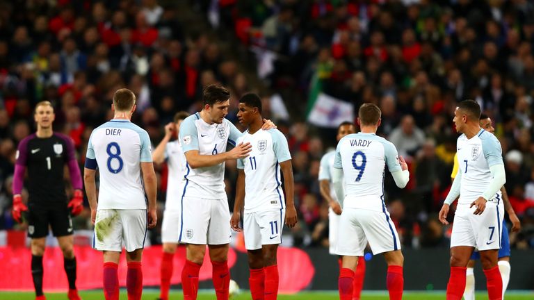 LONDON, ENGLAND - NOVEMBER 14: Harry Maguire of England speaks to Marcus Rashford of England during the international friendly match between England and Br