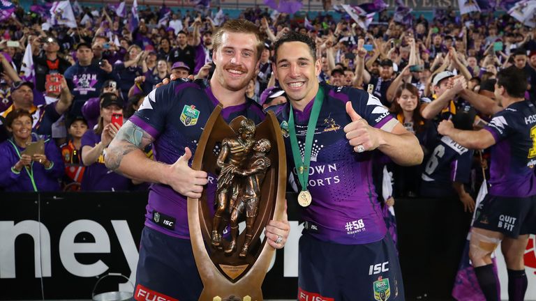 Cameron Munster and Billy Slater celebrate the Storm's Grand Final win over North Queensland Cowboys