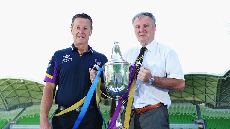 Melbourne Storm head coach Craig Bellamy (L) and Leeds Rhinos CEO Gary Hetherington pose with the World Club Challenge trophy
