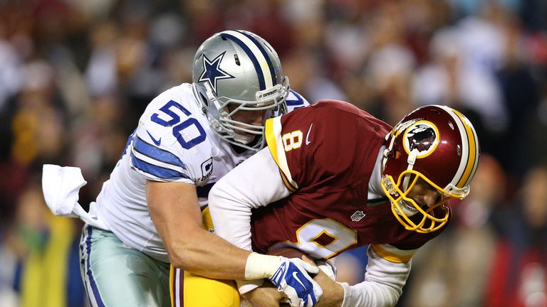 LANDOVER, MD - DECEMBER 7: Quarterback Kirk Cousins #8 of the Washington Redskins is sacked by outside linebacker Sean Lee #50 of the Dallas Cowboys in the