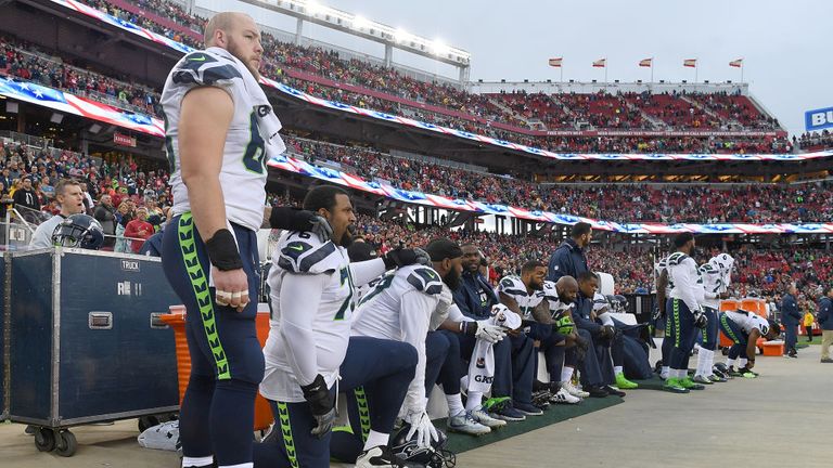 Seattle Seahawks players kneel during the national anthem on Sunday