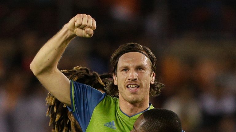 HOUSTON, TX - NOVEMBER 21:  Gustav Svensson #4 of Seattle Sounders celebrates with Kelvin Leerdam #18 and Roman Torres #29 after scoring against the Housto