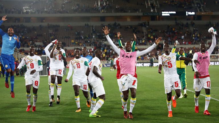 Senegal's players celebrate after qualifying for next summer's World Cup