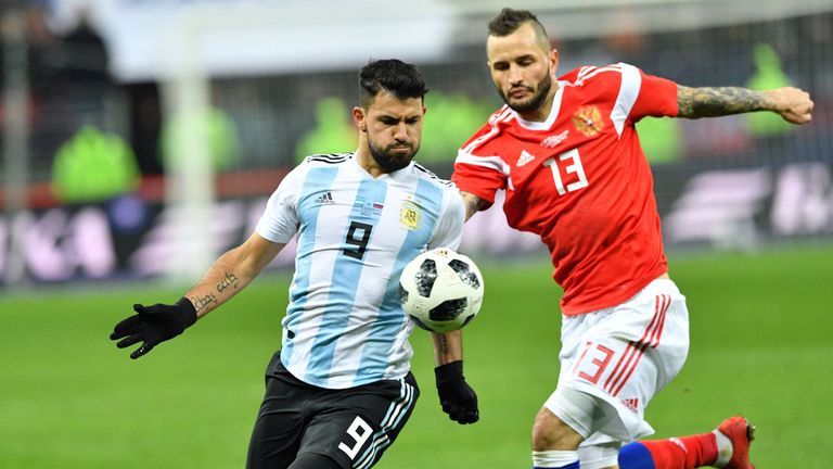 Argentina's Sergio Aguero (L) and Russia's defender Fedor Kudryashov vie for the ball during an international friendly football match between Russia and Ar