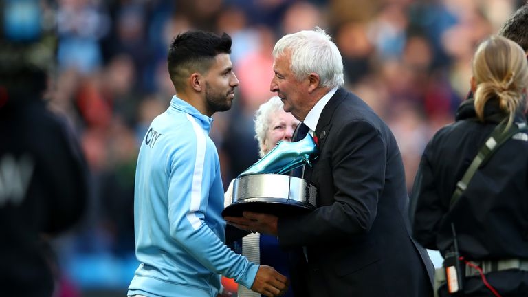 Sergio Aguero being presented with the an award for becoming Manchester City's all time top goal soccer 