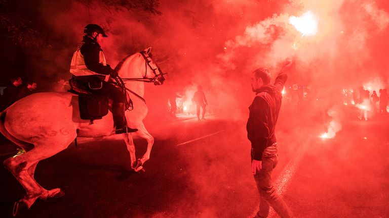 Sevilla fans lit flares as they made their way to the Ramon Sanchez Pizjuan stadium