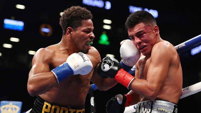 NEW YORK, NY - NOVEMBER 04:  Shawn Porter punches Adrian Granados during their WBC welterweight title eliminator at the Barclays Center on November 4, 2017